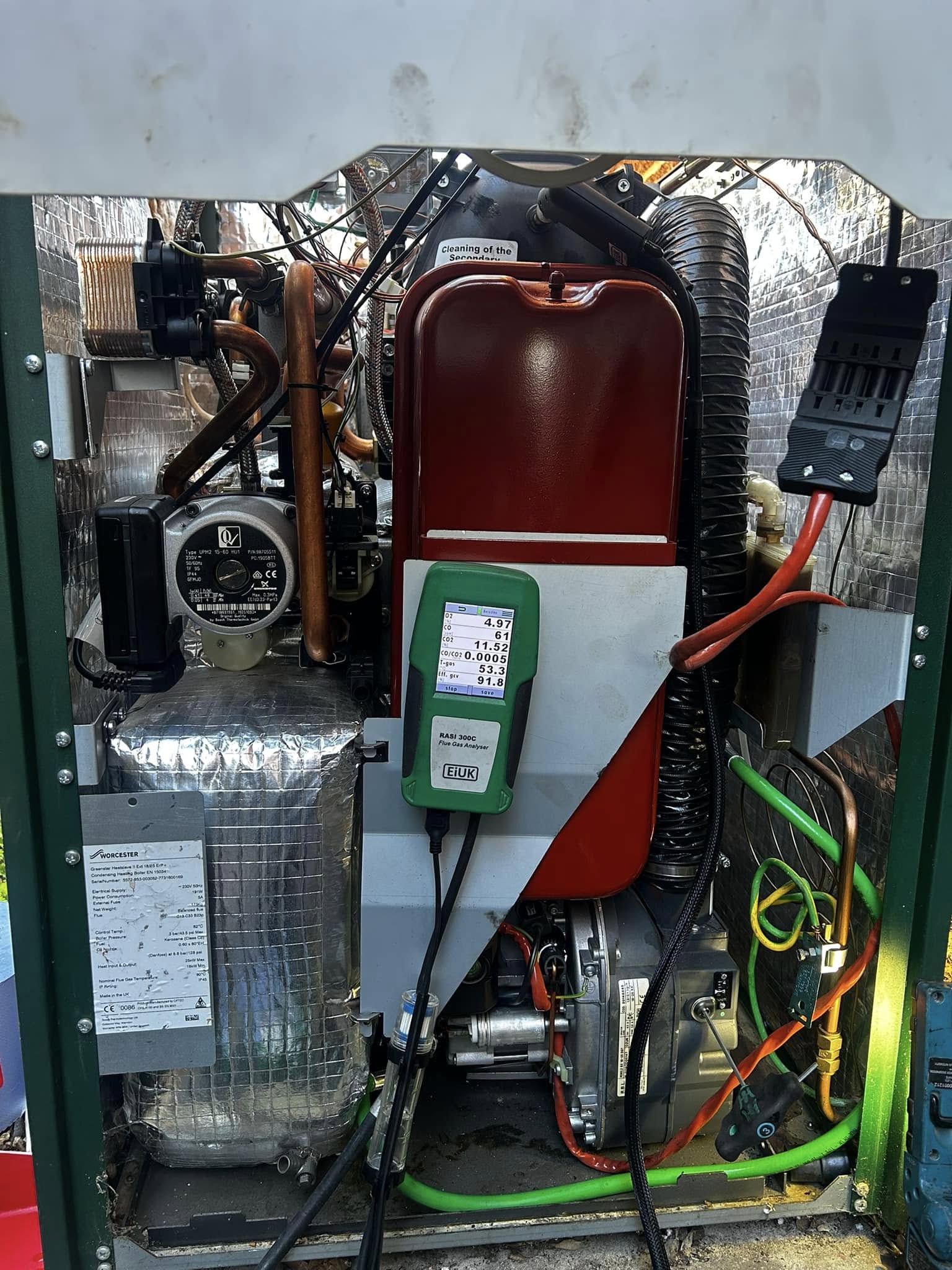 Outdoor oil boiler with the casing off and the analyser attached